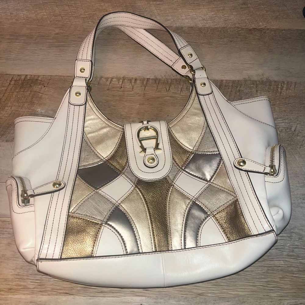 Real Leather Etienne Aigner bag with shape pattern. Gently used